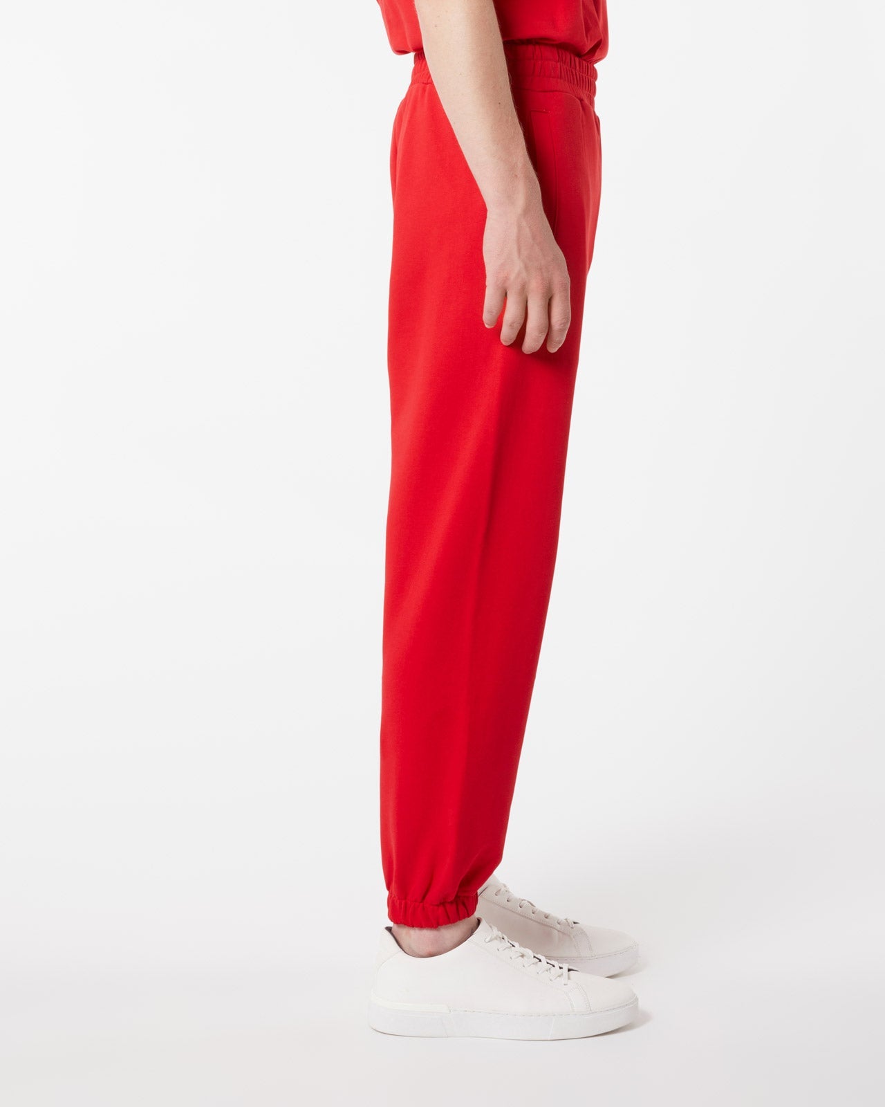 RED PANTS WITH EMBROIDERED FLAMING HEART