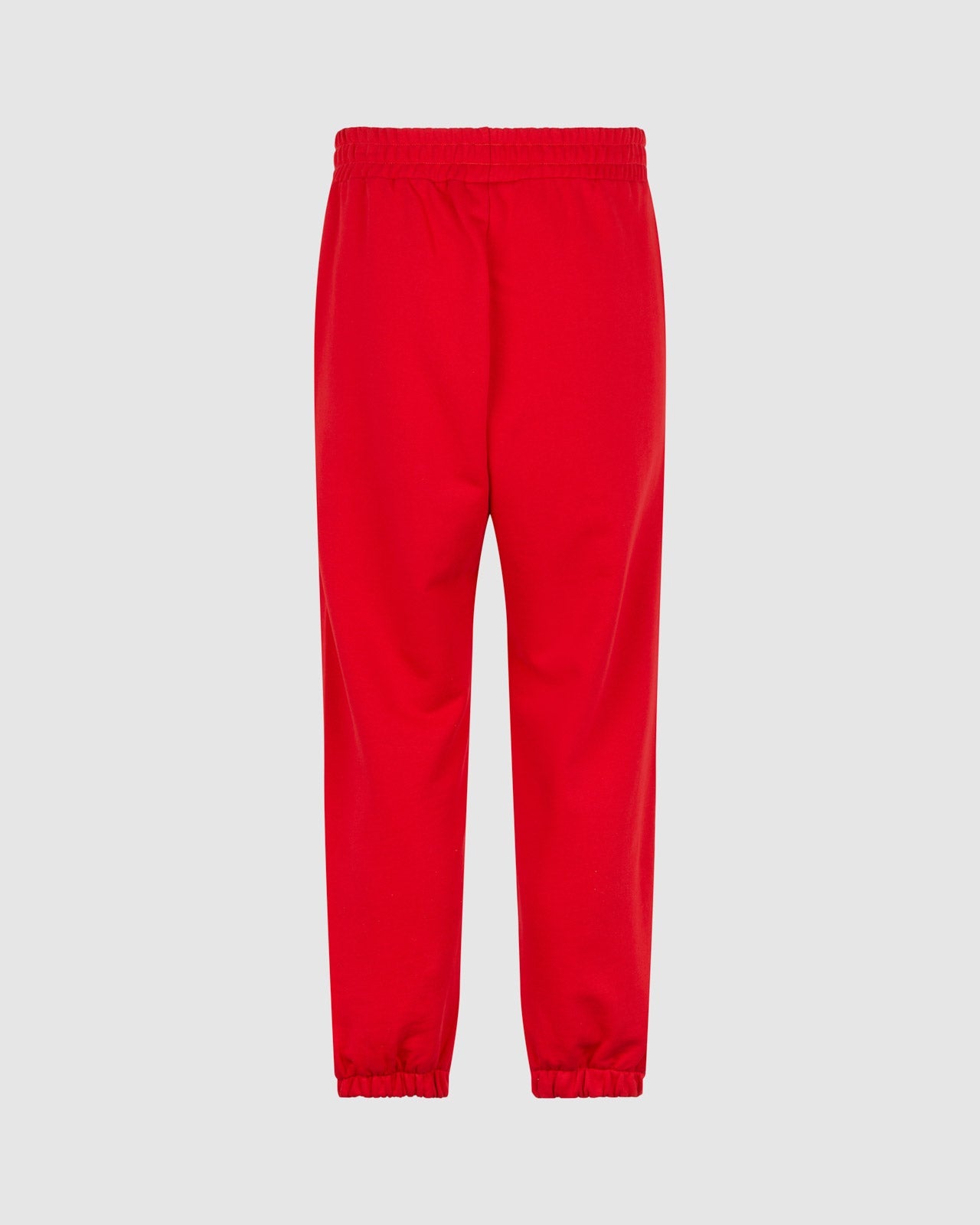 RED PANTS WITH EMBROIDERED FLAMING HEART