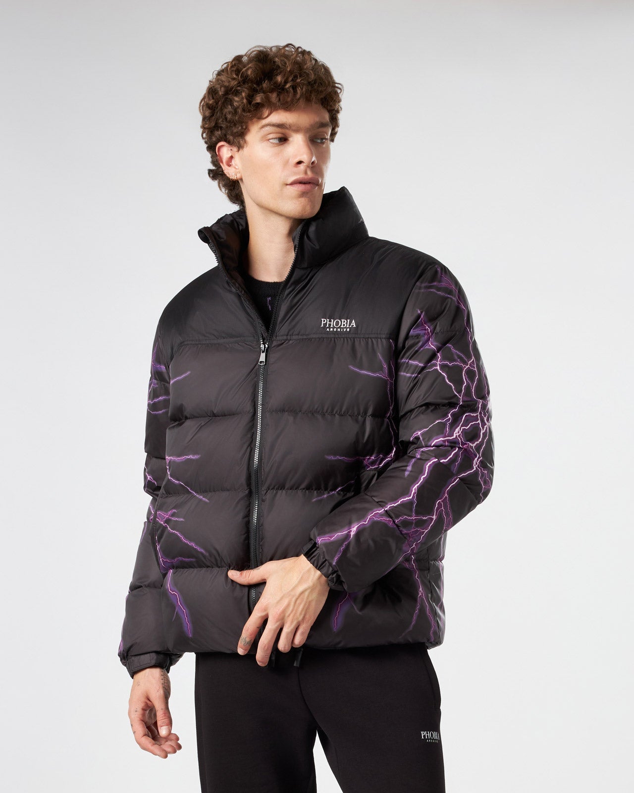 BLACK PUFFER JACKET WITH PURPLE LIGHTNING PRINT