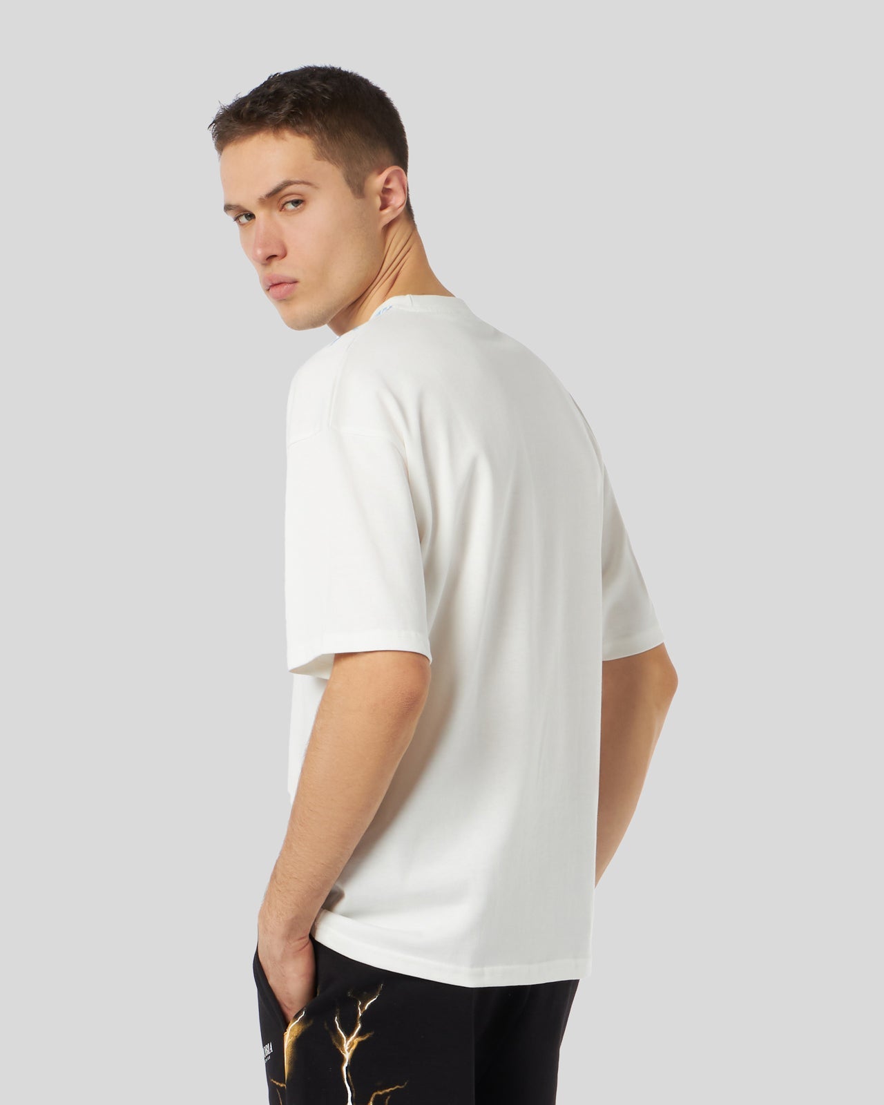 WHITE T-SHIRT WITH BICOLOR BLUE-YELLOW LIGHTNING PRINT