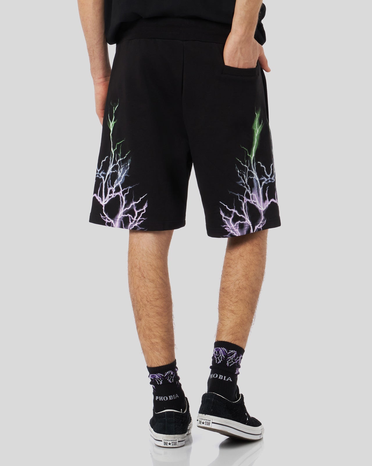 BLACK SHORTS WITH BICOLOR PURPLE-GREEN LIGHTNING PRINT