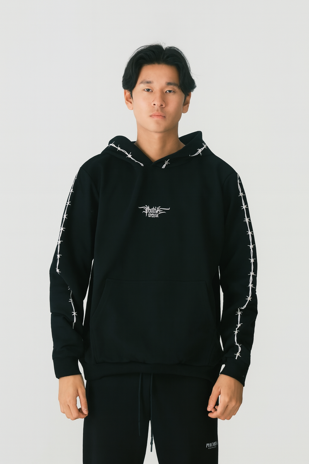 BLACK HOODIE WITH WHITE EMBROIDERED BARBED WIRE AND LOGO
