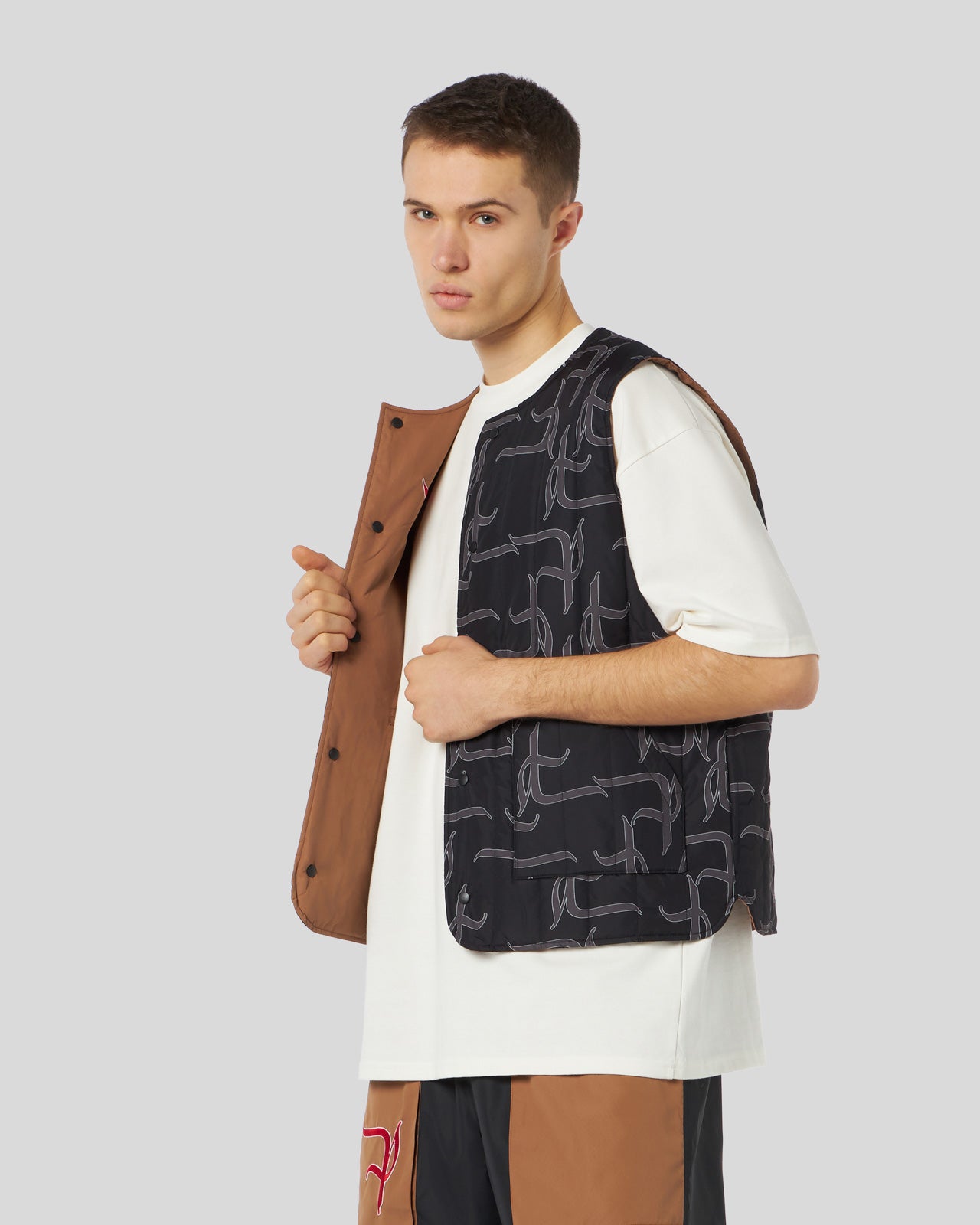 DOUBLE FACE GILET WITH ALL OVER GOTIC P AND BIG LABEL