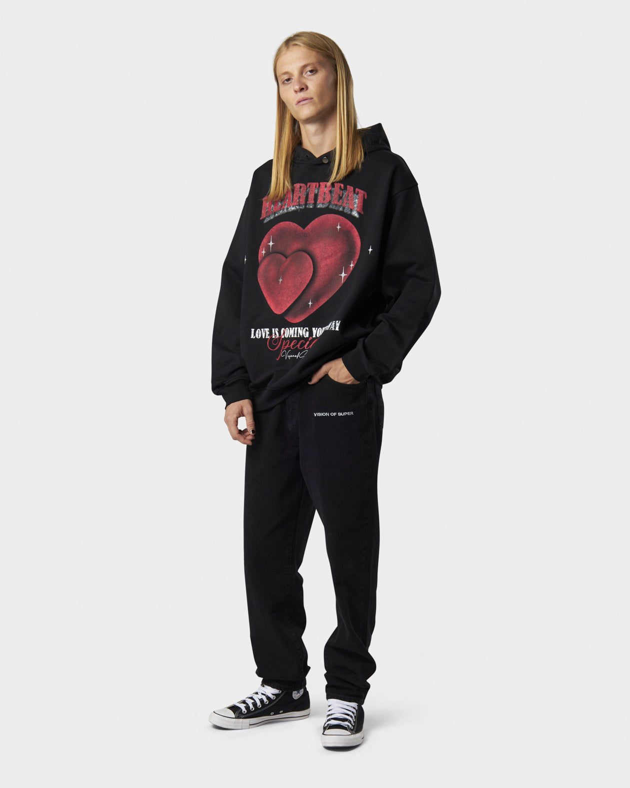 BLACK HOODIE WITH HEARTBEAT PRINT ON FRONT AND METAL LABEL AND BUTTON
