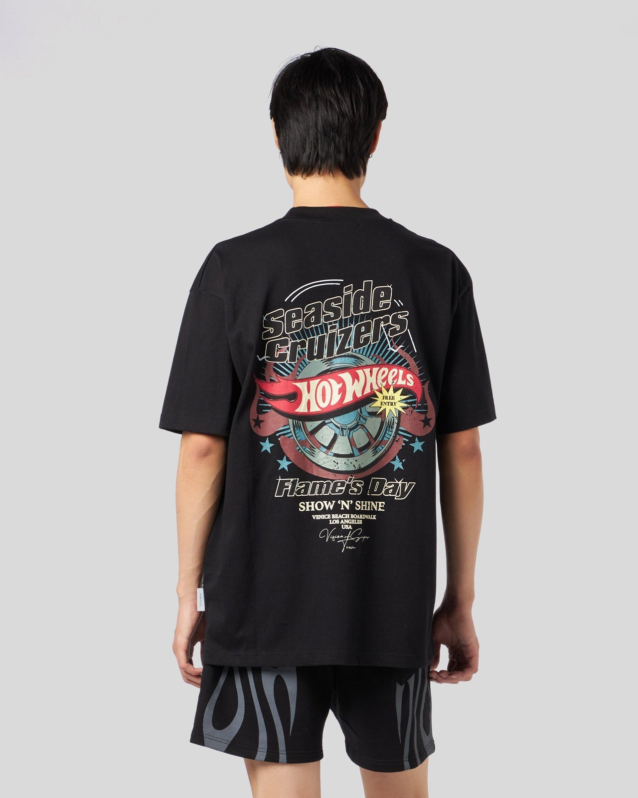 BLACK T-SHIRT WITH ICONIC WHEEL PRINT